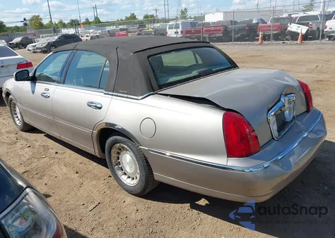 2001 Lincoln Town Car Executive из США, поврежденный, VIN 1LNHM81W71Y709953